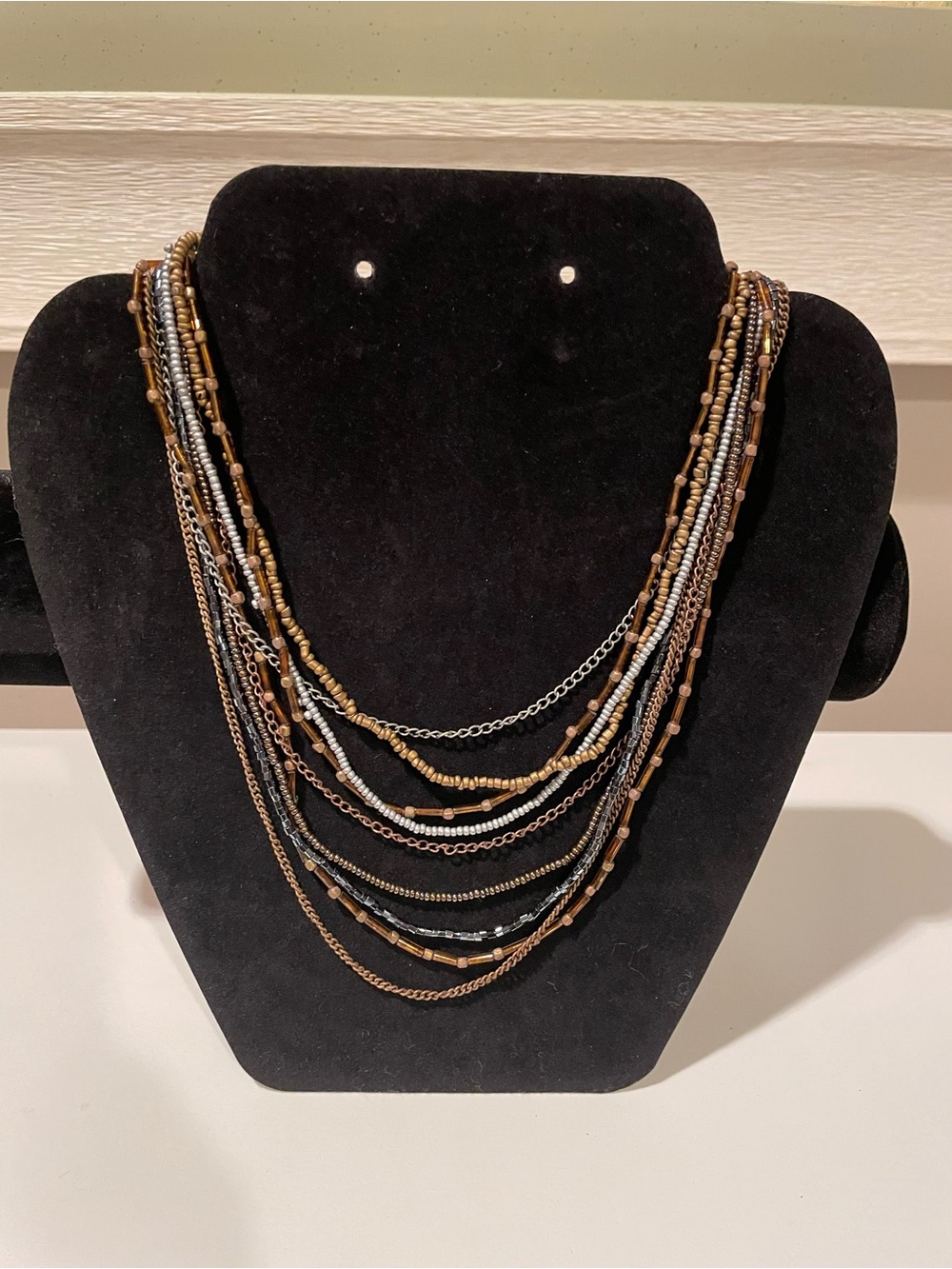 Multi-Strand Layered Necklace in Brown and Black with Gold and Silver Accents